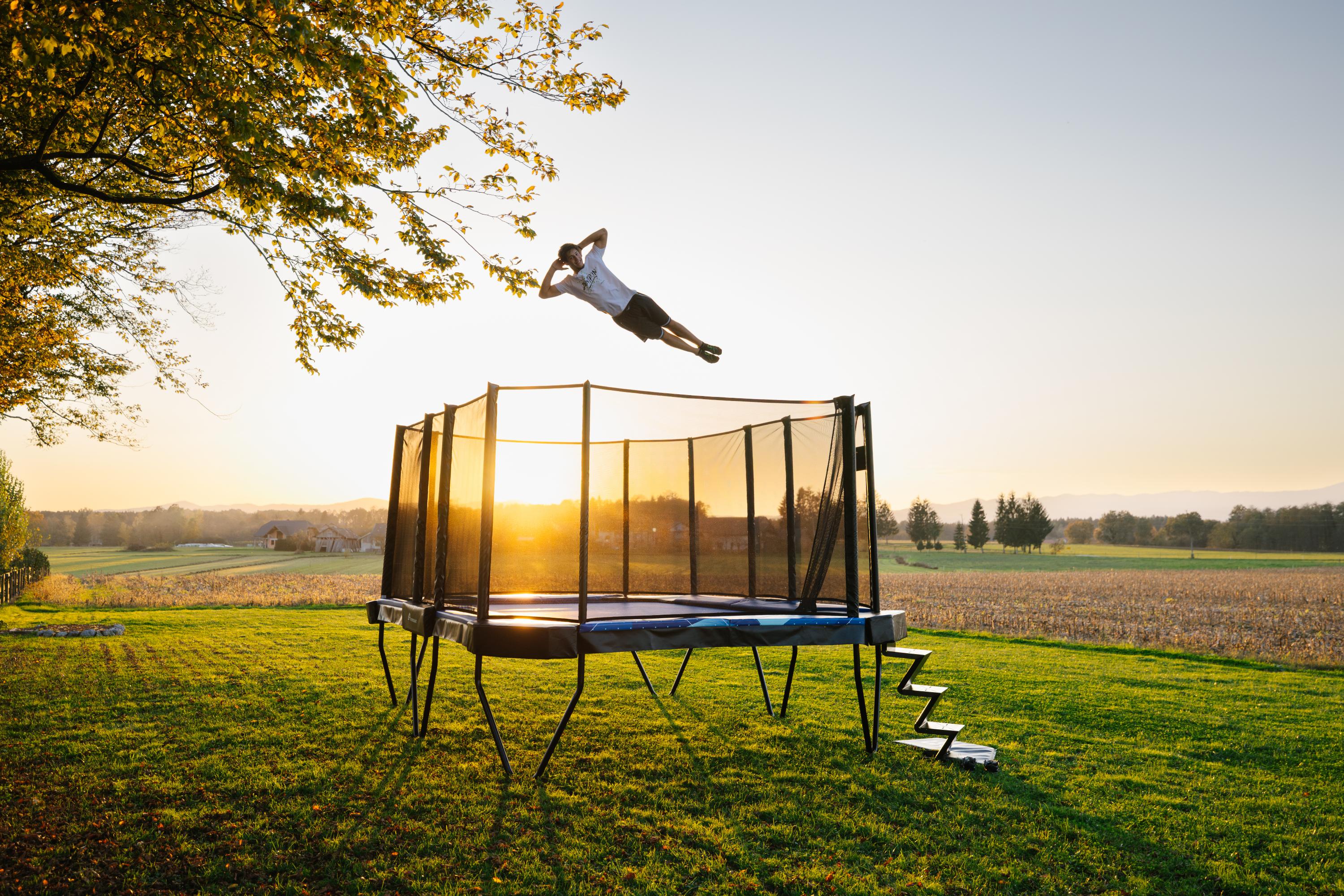 Akrobat Xcity X 17x12ft rectangle trampoline in a UK garden, from Trampolines.co.uk
