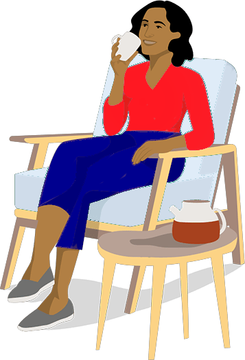 Woman sitting in a chair drinking a cup of coffee