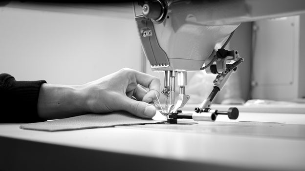 Leather being worked in our partner workshop in Italy