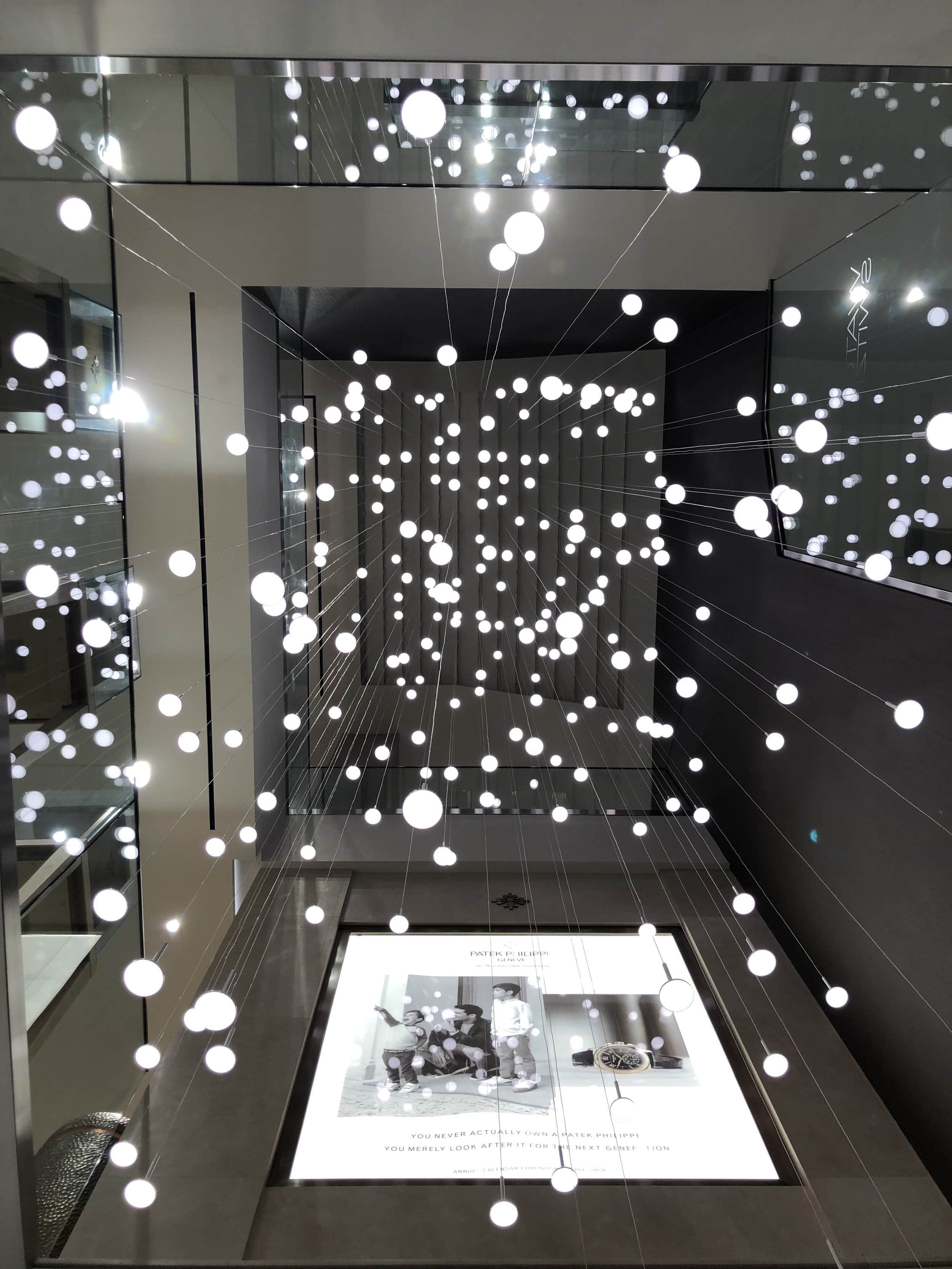 Bespoke hanging light installation by International Chandeliers